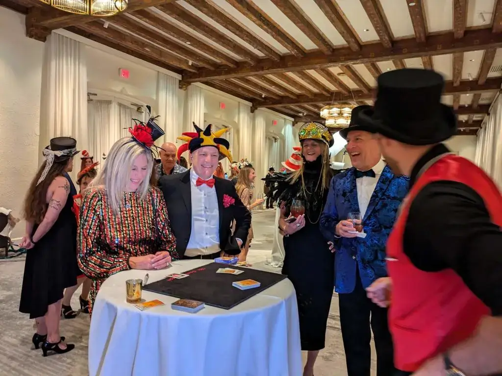 Magician entertaining a group of guests